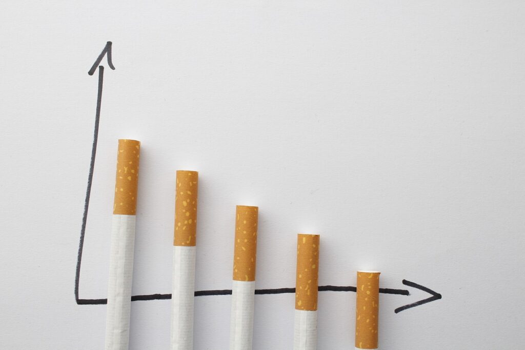 Alt text: A graph depicted with five cigarette butts arranged in ascending order, illustrating an upward trend. The graph is labeled with an arrow pointing to the right, symbolizing growth. The concept relates to Friday Health and its initiatives towards health improvement and smoking cessation.